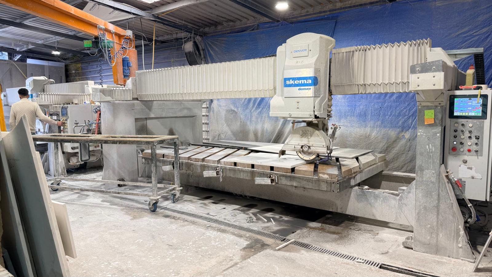 CNC machinery fabricating affordable quartz worktops as part of the quartz worktop price and fitting process.
